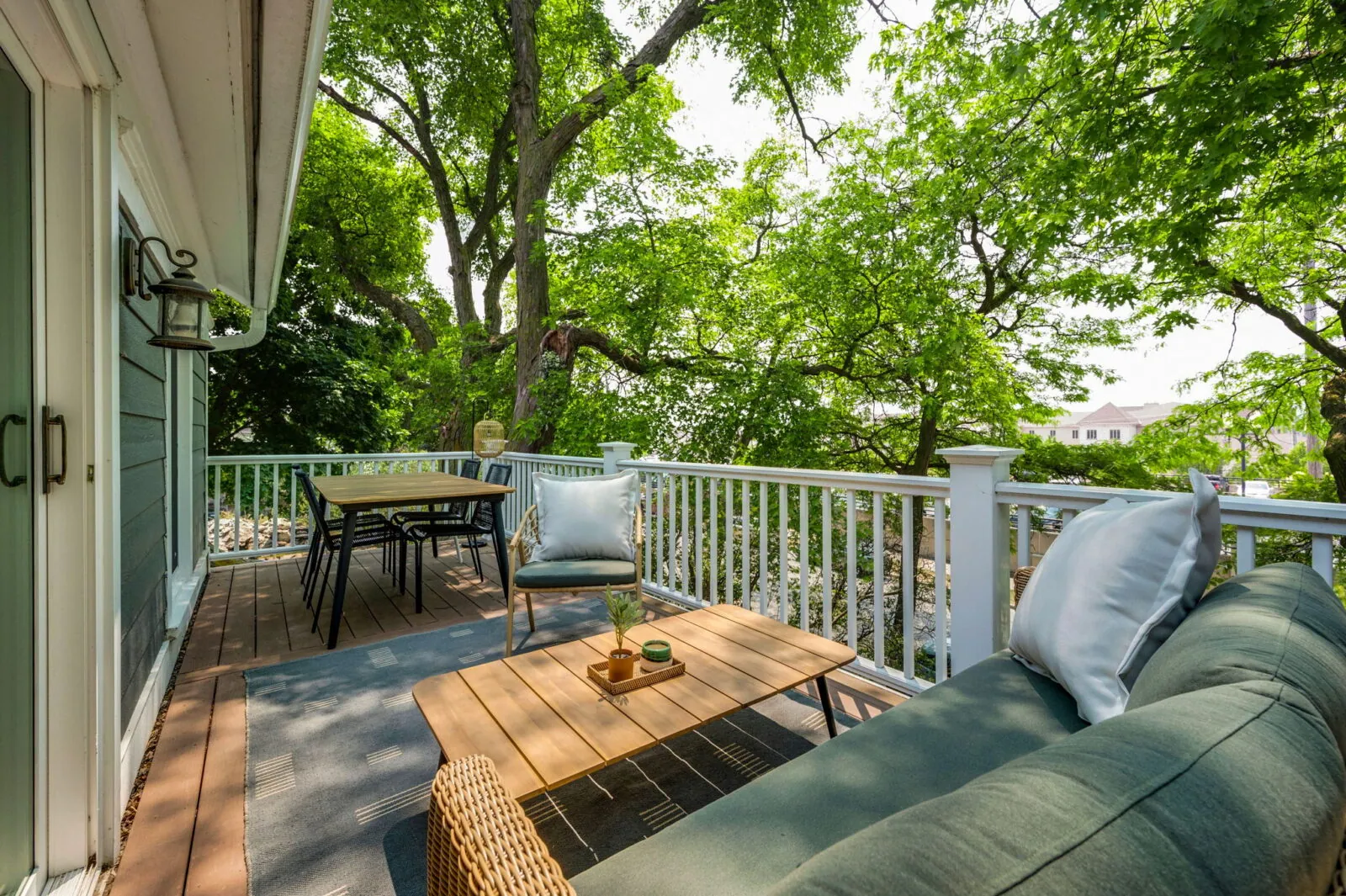 Behold the serene private veranda of the Magnolia Suite. Set against the lush backdrop of the backyard, this oasis is adorned with comfortable, stylish outdoor furniture, inviting you to unwind or dine in the open air. The inviting setup creates the perfect spot for alfresco dining or savoring a quiet moment while basking in the tranquility of the surroundings.